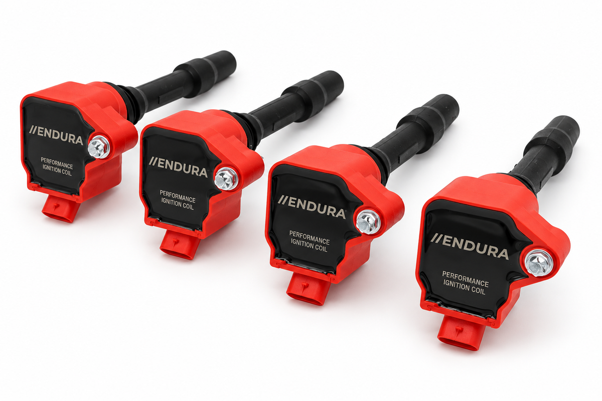 Set van vier rode Endura Performance bobines voor BMW B48 en Mini Cooper S F5x, schuin aanzicht met zwarte aansluitstelen