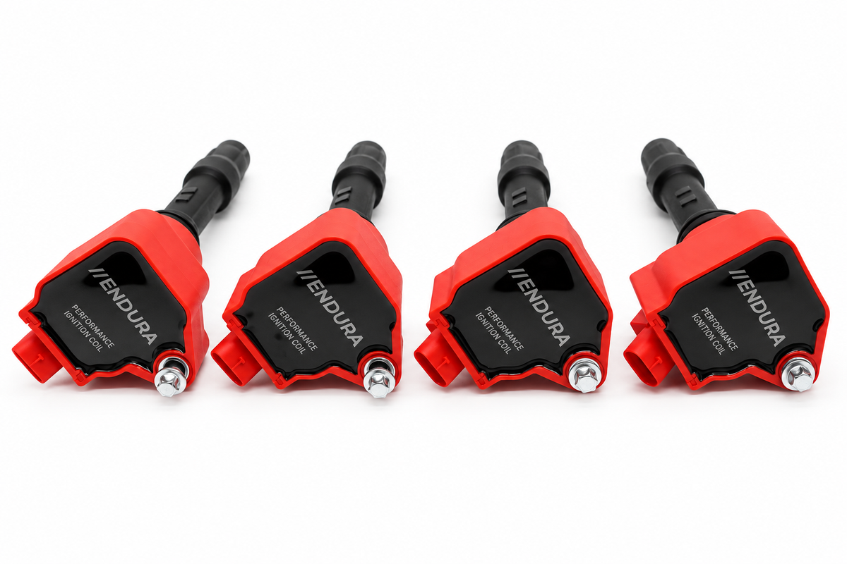 Vier rode Endura Performance bobines voor BMW B48 en Mini Cooper S F5x op een rij, vooraanzicht met Endura-logo
